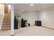 Unfinished basement space showing carpeted floors, recessed lighting, and storage space at 5695 W 109Th Cir, Westminster, CO 80020