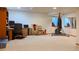 Spacious basement featuring carpeted flooring, a comfortable office area, and room for recreational activities at 5695 W 109Th Cir, Westminster, CO 80020