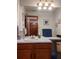 Bright bathroom with a large mirror, vanity, and decor; the decor has a beach theme at 5695 W 109Th Cir, Westminster, CO 80020