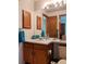 Bathroom featuring a sink with a cabinet, a mirror, a medicine cabinet and a toilet at 5695 W 109Th Cir, Westminster, CO 80020