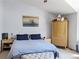 Comfortable bedroom with a king bed, plenty of storage, and neutral decor at 5695 W 109Th Cir, Westminster, CO 80020