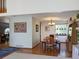 Warm dining area featuring hardwood floors, a chandelier, and a large table with chairs and bench at 5695 W 109Th Cir, Westminster, CO 80020