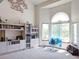 Bright living room featuring a cathedral ceiling, comfortable chair, and natural light from windows at 5695 W 109Th Cir, Westminster, CO 80020