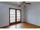 Bedroom featuring french doors to the backyard with a ceiling fan at 2735 S Humboldt St, Denver, CO 80210