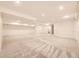 Spacious basement with neutral carpet, trim and paint, offering versatile space for recreation or storage at 5016 S Nelson St # C, Littleton, CO 80127
