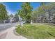 Community entrance with manicured lawn and signage at 5016 S Nelson St # C, Littleton, CO 80127