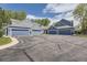 Charming multi-Gathering home featuring multiple garages with blue siding and a well-maintained front yard at 5016 S Nelson St # C, Littleton, CO 80127