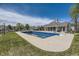 Community pool, with view of a clubhouse, on a beautiful, sunny day at 5016 S Nelson St # C, Littleton, CO 80127
