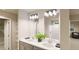 Modern bathroom with double vanity, large mirror, and shower at 22313 E 38Th Pl, Aurora, CO 80019