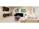 Spacious living room with large windows and ample natural light at 22313 E 38Th Pl, Aurora, CO 80019