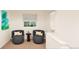 Comfortable sitting area with two chairs, small table, and window at 22313 E 38Th Pl, Aurora, CO 80019