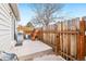 Cozy backyard with concrete patio, wood fence, and grill, perfect for outdoor entertaining at 5711 W 92Nd Ave # 25, Westminster, CO 80031