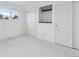 Bright bedroom featuring closet, built-in shelving, and large window providing natural light at 5711 W 92Nd Ave # 25, Westminster, CO 80031