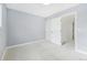 Bright bedroom with light blue walls, closet, and ample natural light at 5711 W 92Nd Ave # 25, Westminster, CO 80031
