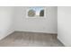 Bright bedroom features wood-look floors and a large window providing plenty of natural light at 5711 W 92Nd Ave # 25, Westminster, CO 80031