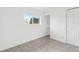 Bright bedroom featuring closet, built-in shelving, and large window providing natural light at 5711 W 92Nd Ave # 25, Westminster, CO 80031