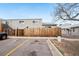 View of the building exterior showing the fenced area and parking lot at 5711 W 92Nd Ave # 25, Westminster, CO 80031