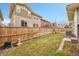 Spacious backyard with lush green grass and a wood fence, offering privacy at 10452 Rutledge St, Parker, CO 80134