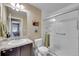 Bathroom featuring a vanity with a sink and a stand up shower with clear glass doors at 10452 Rutledge St, Parker, CO 80134