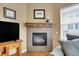 Living room with a fireplace and flatscreen television, creating a warm and inviting atmosphere at 10452 Rutledge St, Parker, CO 80134