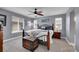 Comfortable main bedroom with a ceiling fan, three windows, and a metal bed frame at 10452 Rutledge St, Parker, CO 80134