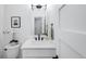 Elegant bathroom features a white vanity with a quartz countertop and modern fixtures at 4640 W 39Th Ave, Denver, CO 80212
