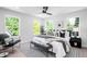Bright bedroom with natural light, a modern ceiling fan, and a comfortable queen-sized bed at 4640 W 39Th Ave, Denver, CO 80212