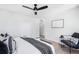 Stylish bedroom with neutral colors, a modern ceiling fan, and a comfortable queen-sized bed at 4640 W 39Th Ave, Denver, CO 80212