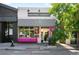 Street-level view of High Point Creamery featuring black and white awning and pink bench at 4640 W 39Th Ave, Denver, CO 80212