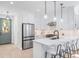 Stylish kitchen with stainless steel appliances, quartz countertops, and a convenient breakfast bar at 4640 W 39Th Ave, Denver, CO 80212