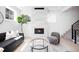 Cozy living room with fireplace, stylish furniture, and natural light streaming through windows at 4640 W 39Th Ave, Denver, CO 80212
