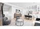 Bright living room featuring modern furniture, an open floor plan, and hardwood floors at 4640 W 39Th Ave, Denver, CO 80212
