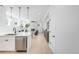 Open floorplan featuring a modern kitchen that flows into a bright living area with fireplace at 4640 W 39Th Ave, Denver, CO 80212