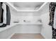 Well-organized walk-in closet with ample shelving and hanging space at 4640 W 39Th Ave, Denver, CO 80212