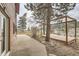 Backyard with wooden pergola, concrete patio, and stunning natural views at 26167 De Berry St, Conifer, CO 80433