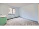 Bedroom features a window with exterior view and light blue paint at 26167 De Berry St, Conifer, CO 80433