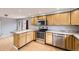 Traditional kitchen showcasing wood cabinets, stainless steel appliances, and durable countertops at 26167 De Berry St, Conifer, CO 80433