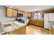 Traditional kitchen showcasing wood cabinets, stainless steel appliances, and durable countertops at 26167 De Berry St, Conifer, CO 80433