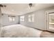 Spacious living room with recessed lighting and multiple windows to view outside at 26167 De Berry St, Conifer, CO 80433
