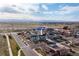 Aerial view of 711 Elm, Frederick, Colorado, with mountain views and open space under a partly cloudy blue sky at 711 Elm St, Frederick, CO 80530