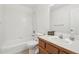 Neutral bathroom featuring combination tub and shower, single sink vanity at 711 Elm St, Frederick, CO 80530