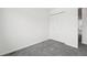 Neutral bedroom featuring double door closet and neutral carpet at 711 Elm St, Frederick, CO 80530