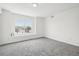 Bright bedroom with a large window, new carpet, and fresh, white paint at 711 Elm St, Frederick, CO 80530