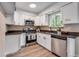 Modern kitchen featuring stainless steel appliances, sleek countertops, and ample white cabinetry at 8952 W Stanford Ave, Denver, CO 80123