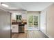 Modern kitchen featuring stainless steel appliances, sleek countertops, and ample white cabinetry at 8952 W Stanford Ave, Denver, CO 80123