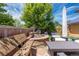 Serene backyard featuring a stone bench, water feature, and comfortable outdoor seating at 507 Ulster Way, Denver, CO 80230