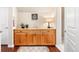 The bar area features a wooden cabinet with stone countertops, complemented by hardwood floors and stylish decor at 507 Ulster Way, Denver, CO 80230