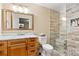 Bathroom boasts a glass-enclosed shower with tiled walls, a vanity with sink, and stylish fixtures at 507 Ulster Way, Denver, CO 80230