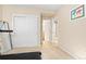 Bright bedroom featuring a carpeted floor, closet, and an ensuite bathroom, offering comfort and convenience at 507 Ulster Way, Denver, CO 80230