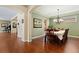 Formal dining room with hardwood floors and chandelier at 507 Ulster Way, Denver, CO 80230